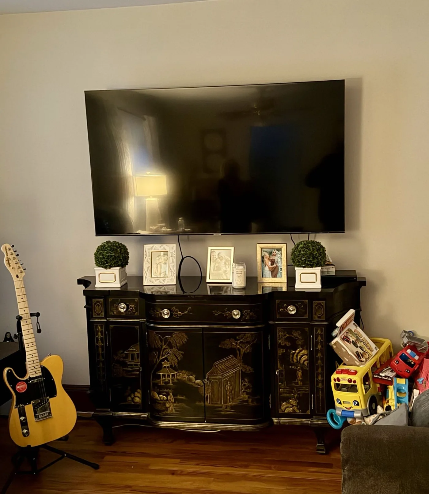 Before: TV mounted over an antique cabinet